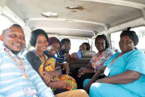 A group of people sit in a car