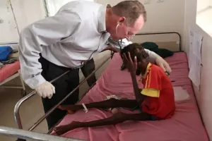 Paul Farmer with patient