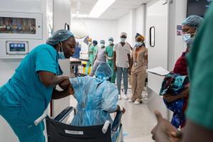 Patient Fanta Jimmy heads into the operating theater