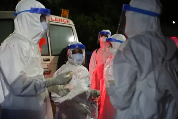 clinicians and sprayers prepare to receive patients 