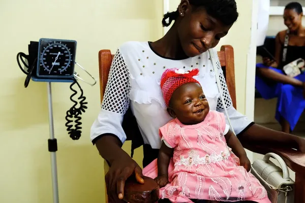 woman in hospital with baby on her lap