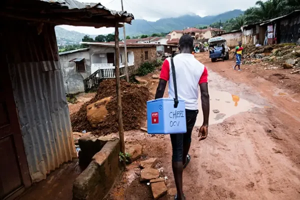 A government health worker takes the cholera vaccine door-to-door