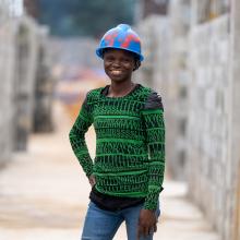 woman in hard hat at construction site