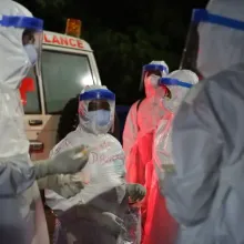 clinicians and sprayers prepare to receive patients 