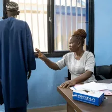 A nurse takes some measurements of a patient