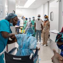 Patient Fanta Jimmy heads into the operating theater