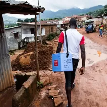 A government health worker takes the cholera vaccine door-to-door