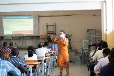 A clinician leads a training on COVID-19.