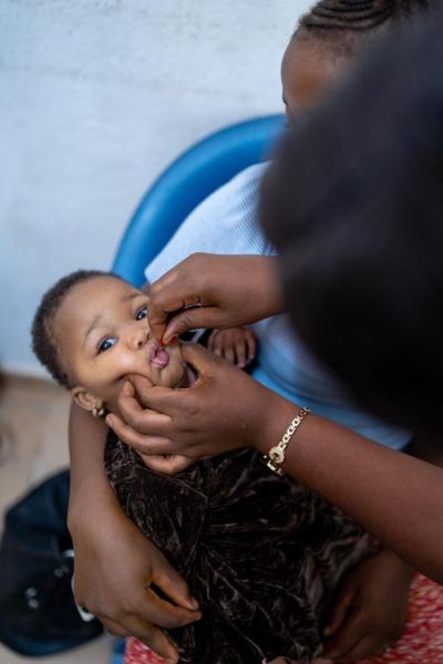 A baby gets a vitamin A supplement.