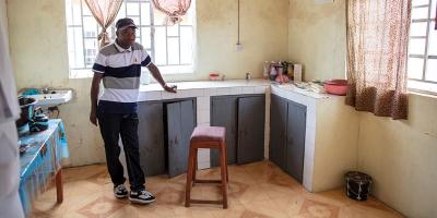 A man stands in a room that used to serve as a laboratory