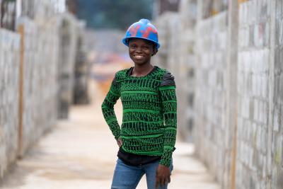 woman in hard hat at construction site