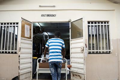 Clinical officer Alhaji Kargbo refers a patient to the adult emergency department at Koidu Government Hospital.