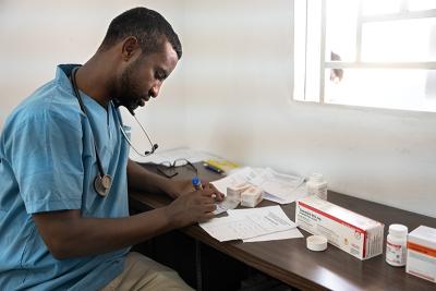 doctor in the pharmacy puts together medication