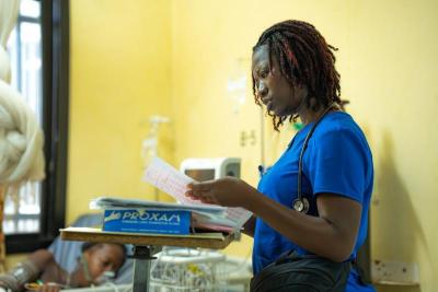 nurse looks at files inside hospital