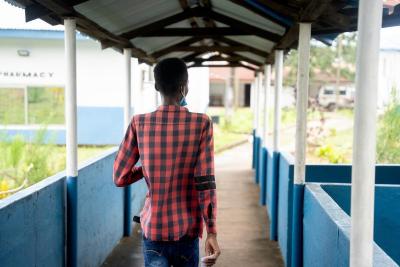Santigie M. Conteh moves through Lakka Government Hospital on the day of his discharge.