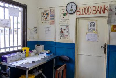 A small office with a door showing the entrance to the blood bank