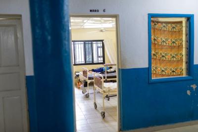 A doorway into a ward in Koidu Government Hospital showing patient beds.