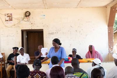 A midwife presents in front of the crowd