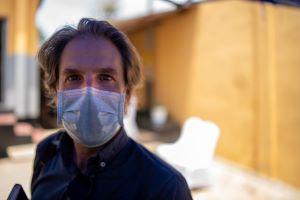 Jon Lascher, masked to prevent the spread of COVID-19.