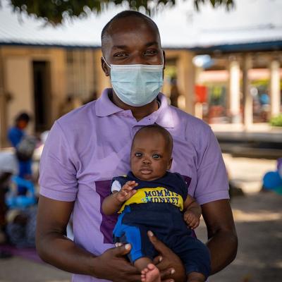 A man holding a baby