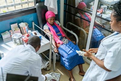 A woman donates blood