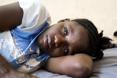 A woman sleeps on a hospital bed