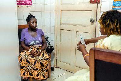 A new mother listens to a nurse on family planning methods