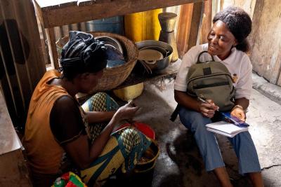 Community Health Worker Christiana Morquee visits patient Aminata Sankoh at home 