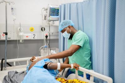 Nurse Frank Mohamed Rogers follows up on patients in the post-op ward
