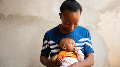 Phebian Baningo holds her daughter Grace