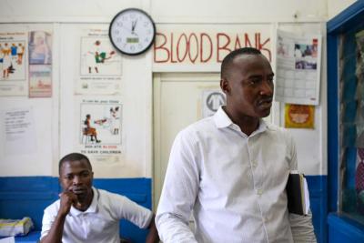 Two men infront of the blood bank