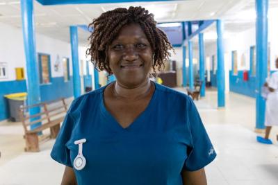 A picture of a nurse standing in a ward